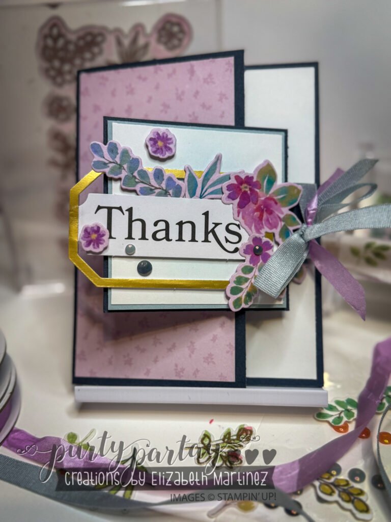 Floral washi tape layered over pastel cardstock for a soft, dimensional card background.