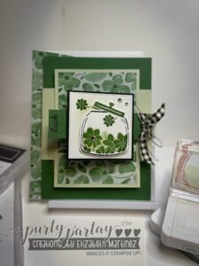 Flip-flop fold card featuring clover-inspired designs in green Regal DSP with gold details and a hidden message.