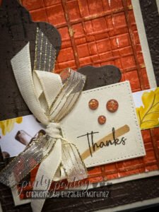 Focal point of embossed brick and plaid textures layered together with added shading, shimmer, and distress sanding.